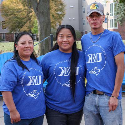 The Garcia Santos family pose for a photo outside the student union